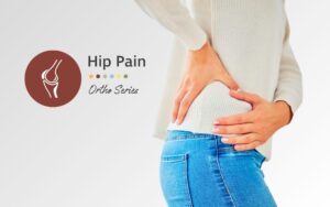 person holding hip, indicating experiencing hip pain