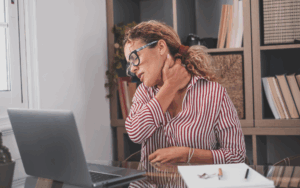 Female sitting at a desk with pinched nerve